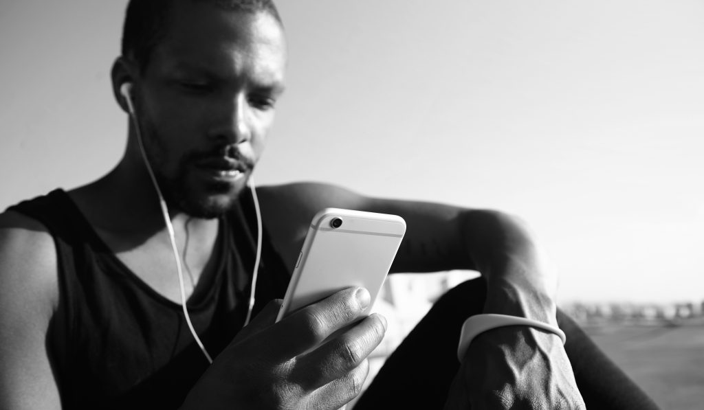 Portrait of pensive handsome dark-skinned man with little beard