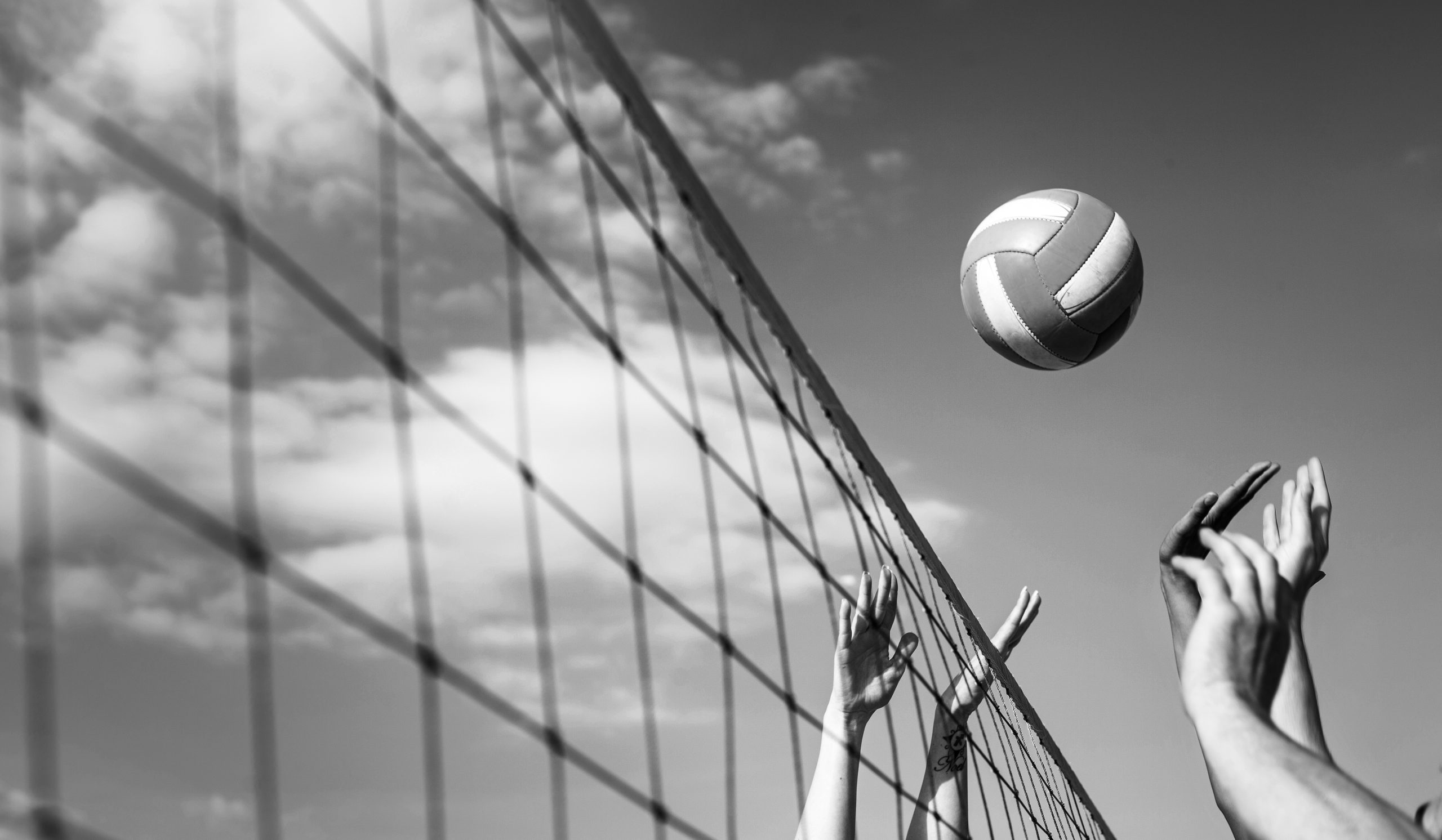 Cropped image of people Volleyball at beach
