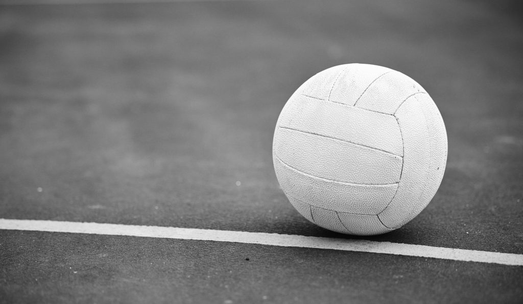 Netball on the ground on a sports court for a match, training or exercise outdoor on a field. Sport.